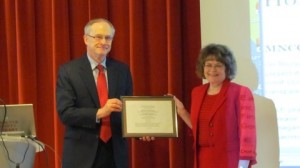 John R. Finnegan Jr. presents the John R. Finnegan Freedom of Information Award to Michele Timmons.